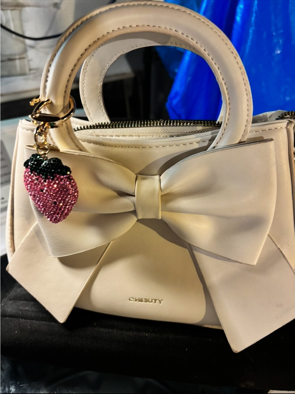 Cream Bow Top-Handle Bag with Pink Strawberry Charm
